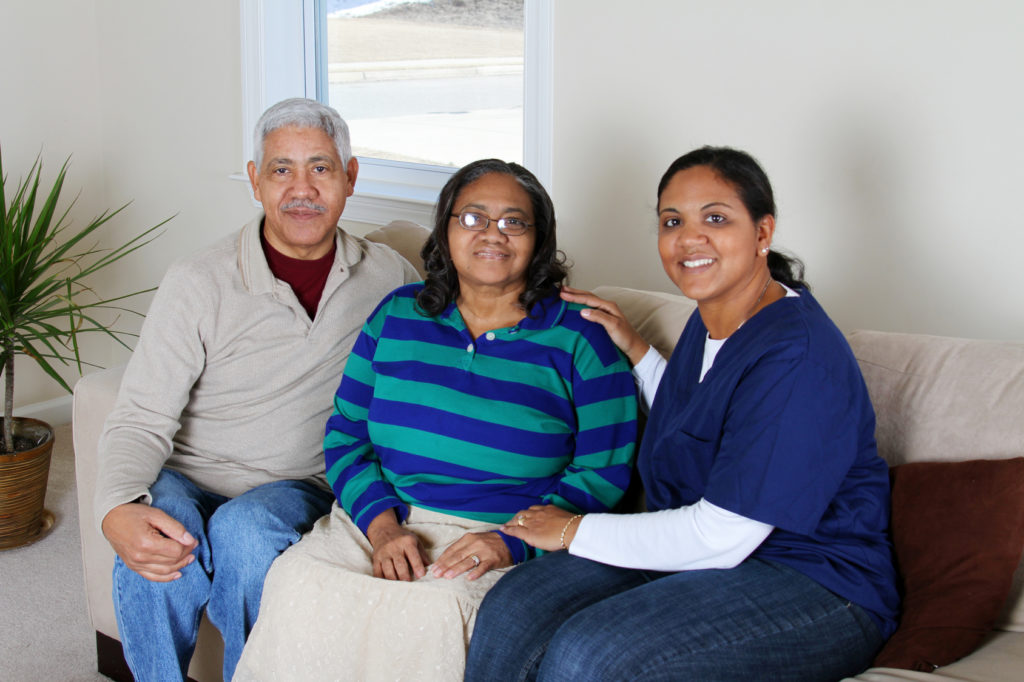 Home care worker and an elderly couple